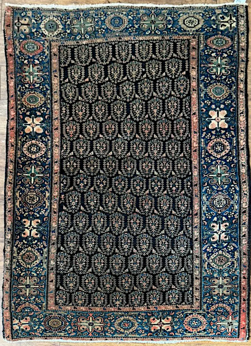 082426-1.webp | McFarlands Carpet and Rug Service Vintage 1940s Persian Farahan Sarouk hand-knotted wool area rug 3.9' x 5.10' with a dark floral field and cobalt blue outer border.