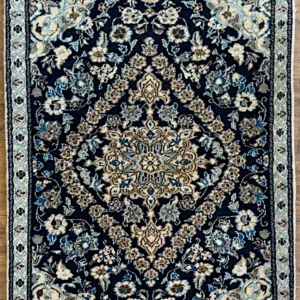 Hand-knotted Persian Nain wool and silk area rug 3' x 4.5' with a midnight navy field, ivory star medallion, ice blue floral borders, and silk highlights.