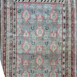 Antique East Turkestan Samarkand Khotan wool area rug 4.6' x 7.10' c. 1890-1920 in soft slate blue, cream, and coral pink with pomegranate motifs.