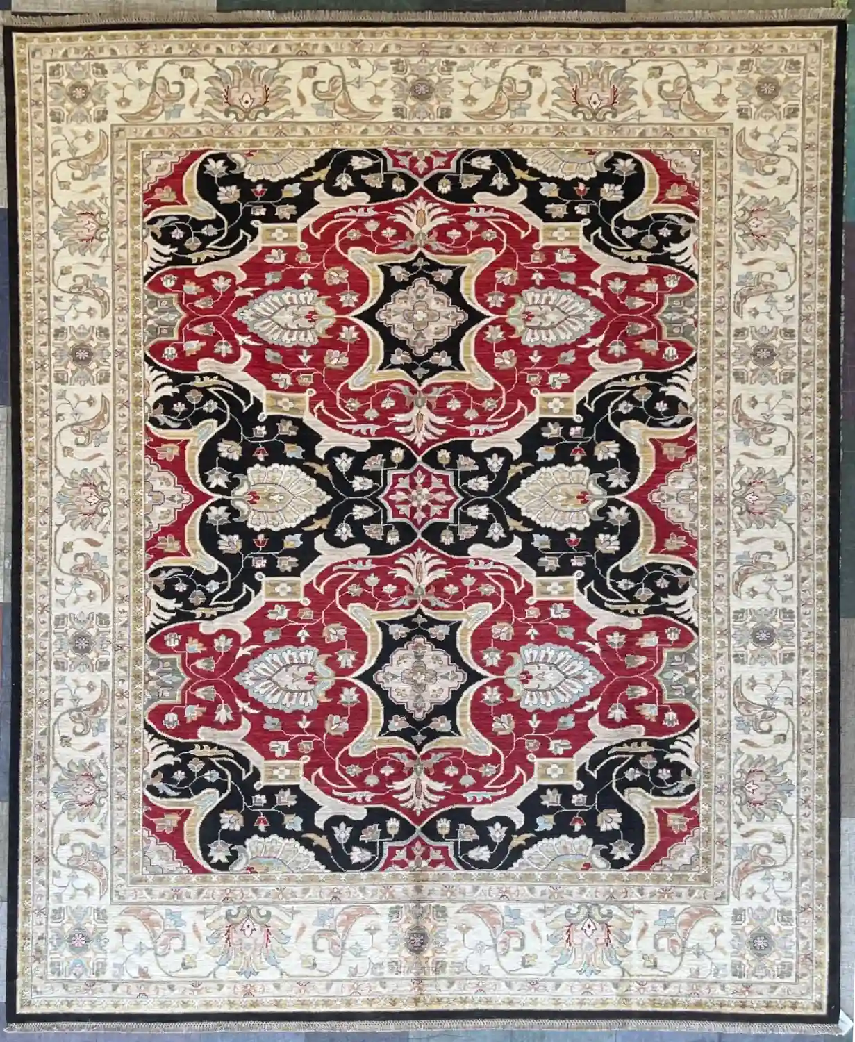 hand-knotted-chobi-wool-area-rug-8-2-x-10-2-crimson-red-charcoal-black-sku-112525-14.webp | McFarlands Carpet and Rug Service Black and red hand-knotted Chobi wool area rug 8.2' x 10.2' with a double medallion center and cream border.