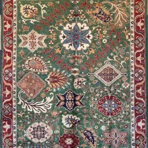 Emerald green hand-knotted Chobi wool area rug 8' x 10.5' with an eclectic layout of traditional medallions and red border.