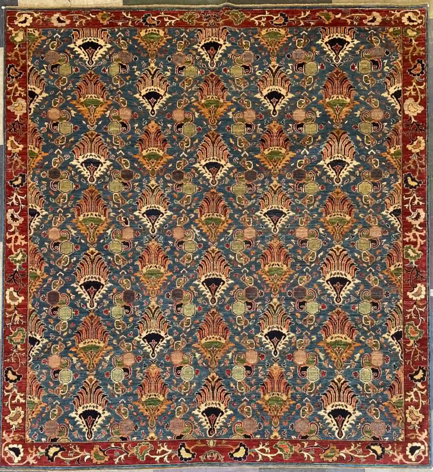 hand-knotted-chobi-peshawar-wool-area-rug-8-3-x-9-6-steel-blue-shah-abbas-sku-112525-17.webp | McFarlands Carpet and Rug Service Steel blue hand-knotted Peshawar Chobi wool area rug 8.3' x 9.6' featuring an all-over Shah Abbas palmette pattern and a terracotta red border.