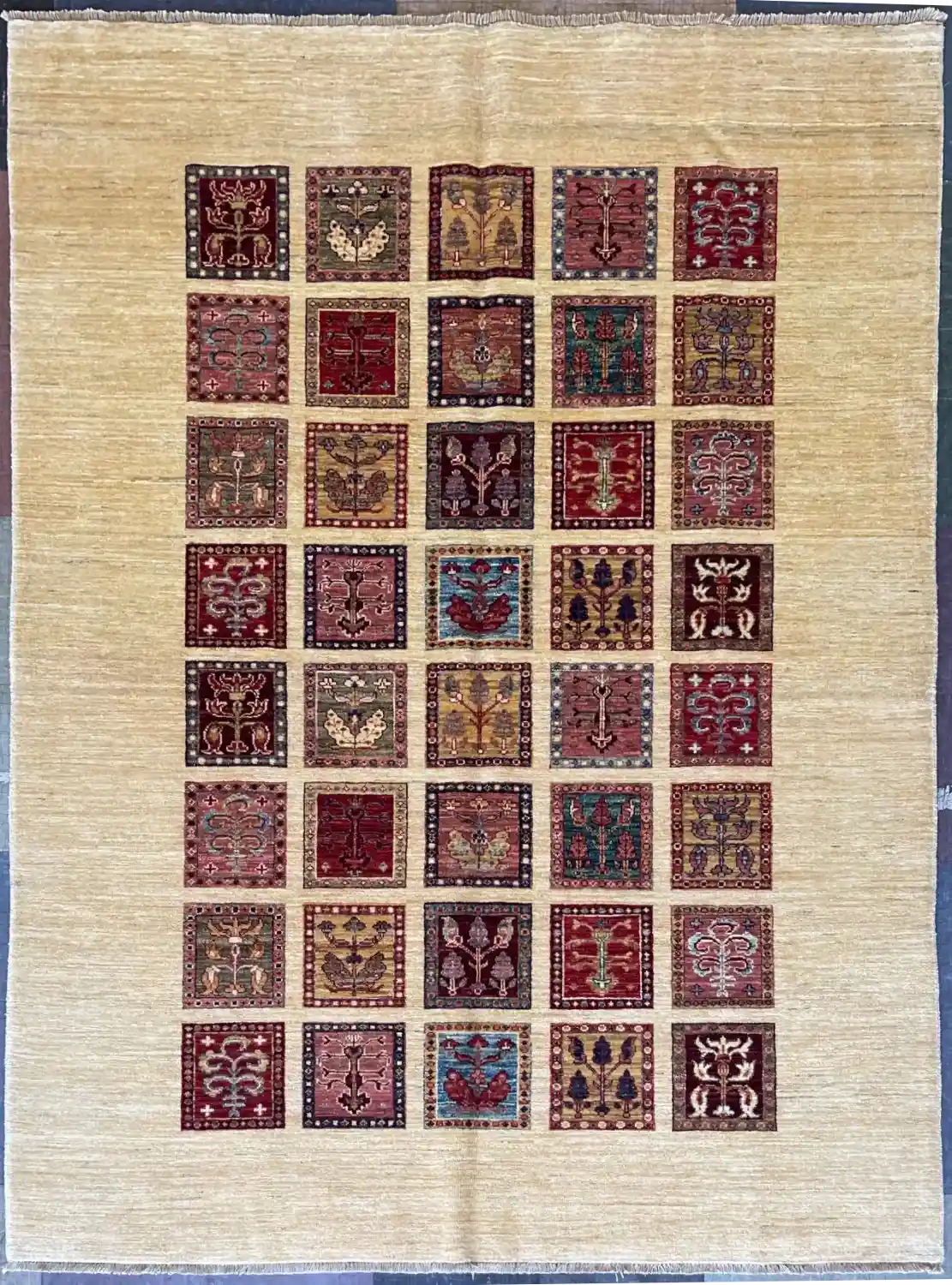 garden-panel-chobi-wool-rug-5x7.webp | McFarlands Carpet and Rug Service Multicolor hand-knotted garden panel Chobi wool area rug 5.6' x 7.3' showcasing a forty compartment floral and tree motif grid.