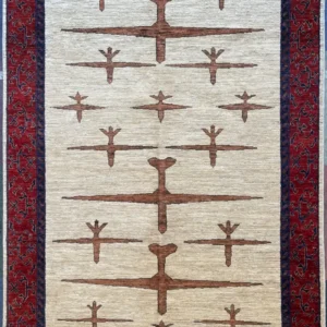 Hand-knotted modern tribal wool area rug 5.5' x 8.2' featuring rust geometric motifs on a cream field with a crimson red border.