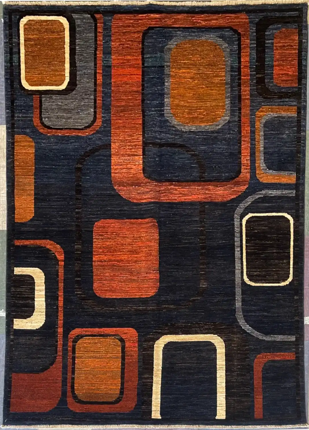 mid-century-modern-geometric-rug-6x9.webp | McFarlands Carpet and Rug Service Terracotta, orange, and charcoal geometric frame hand-knotted wool area rug 5.8' x 8' featuring an asymmetrical Mid-Century Modern squircle pattern.