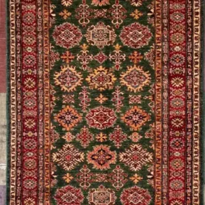 Traditional green Kazak hand-knotted wool runner rug 4.1' x 12.6' featuring a dense geometric star medallion field and a wide crimson red border frame.