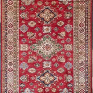 Hand-knotted Kazak wool rug 5.7' x 10.7' featuring a scarlet red field, a central sage green stepped diamond medallion, and an ivory geometric border.
