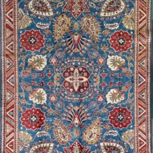 Hand-knotted Chobi wool area rug 6.2' x 8.7' featuring an azure blue field, central floral medallion, rust red palmettes, and a geometric zigzag border.