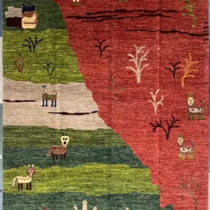 Hand-knotted pictorial wool area rug 6.2' x 9' featuring an alien desert scene in terracotta rust, sage, and olive green.