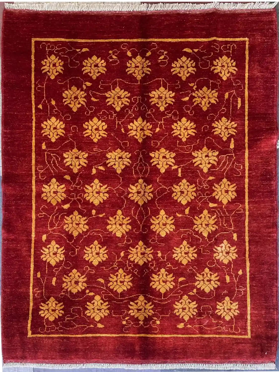 modern-red-turkmen-floral-wool-rug-4x6.webp | McFarlands Carpet and Rug Service Modern red Turkmen hand-knotted wool area rug 4.4' x 5.9' featuring a contemporary all-over gold floral rosette pattern and thin gold line border frame.