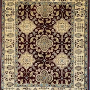 burgundy-chobi-peshawar-floral-wool-rug-5x7.webp | McFarlands Carpet and Rug Service Traditional burgundy Chobi Peshawar hand-knotted wool area rug 5.3' x 6.8' featuring a repeating cream floral medallion grid layout and a wide ivory border frame.