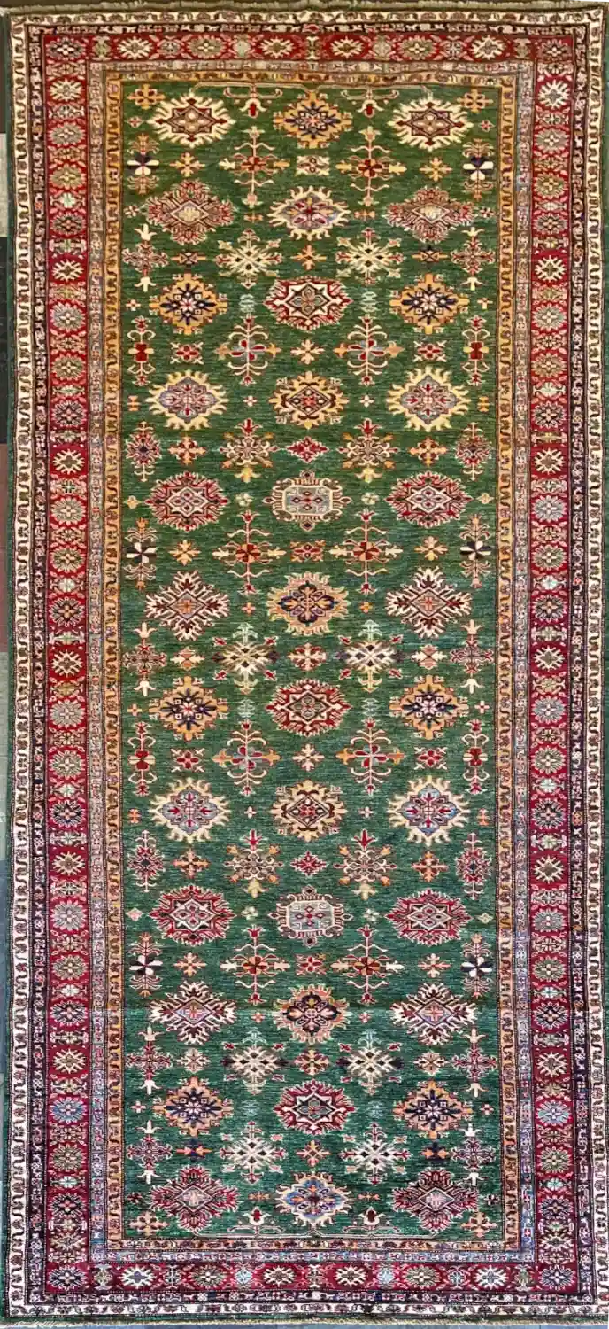 traditional-green-kazak-extra-wide-wool-runner-rug.webp | McFarlands Carpet and Rug Service Traditional green Kazak hand-knotted wool extra-wide runner rug 4.9' x 12.6' featuring a dense vertical geometric medallion layout and a wide red border frame.
