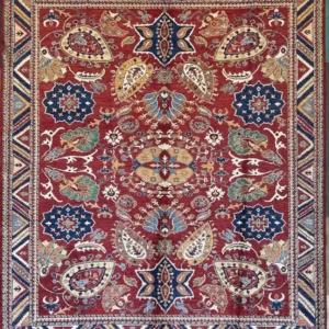 Red Hand-Knotted Chobi Wool Area Rug 8.7' x 9.10' with blue floral rosettes and geometric chevron borders.