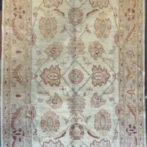 Traditional Chobi Peshawar hand-knotted wool area rug 5.9' x 8.10' featuring a soft ivory field with a sage green floral ogee lattice design and camel border frame.