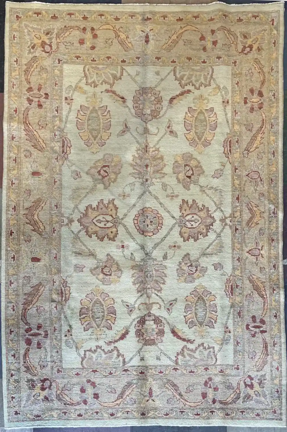 traditional-ivory-sage-chobi-peshawar-wool-rug-6x9.webp | McFarlands Carpet and Rug Service Traditional Chobi Peshawar hand-knotted wool area rug 5.9' x 8.10' featuring a soft ivory field with a sage green floral ogee lattice design and camel border frame.