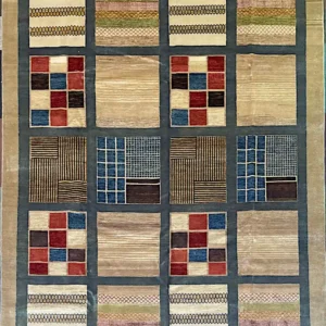 Modern hand-knotted wool area rug 9.1' x 12.4' featuring an illustrative twenty-square patchwork grid framed in slate blue.