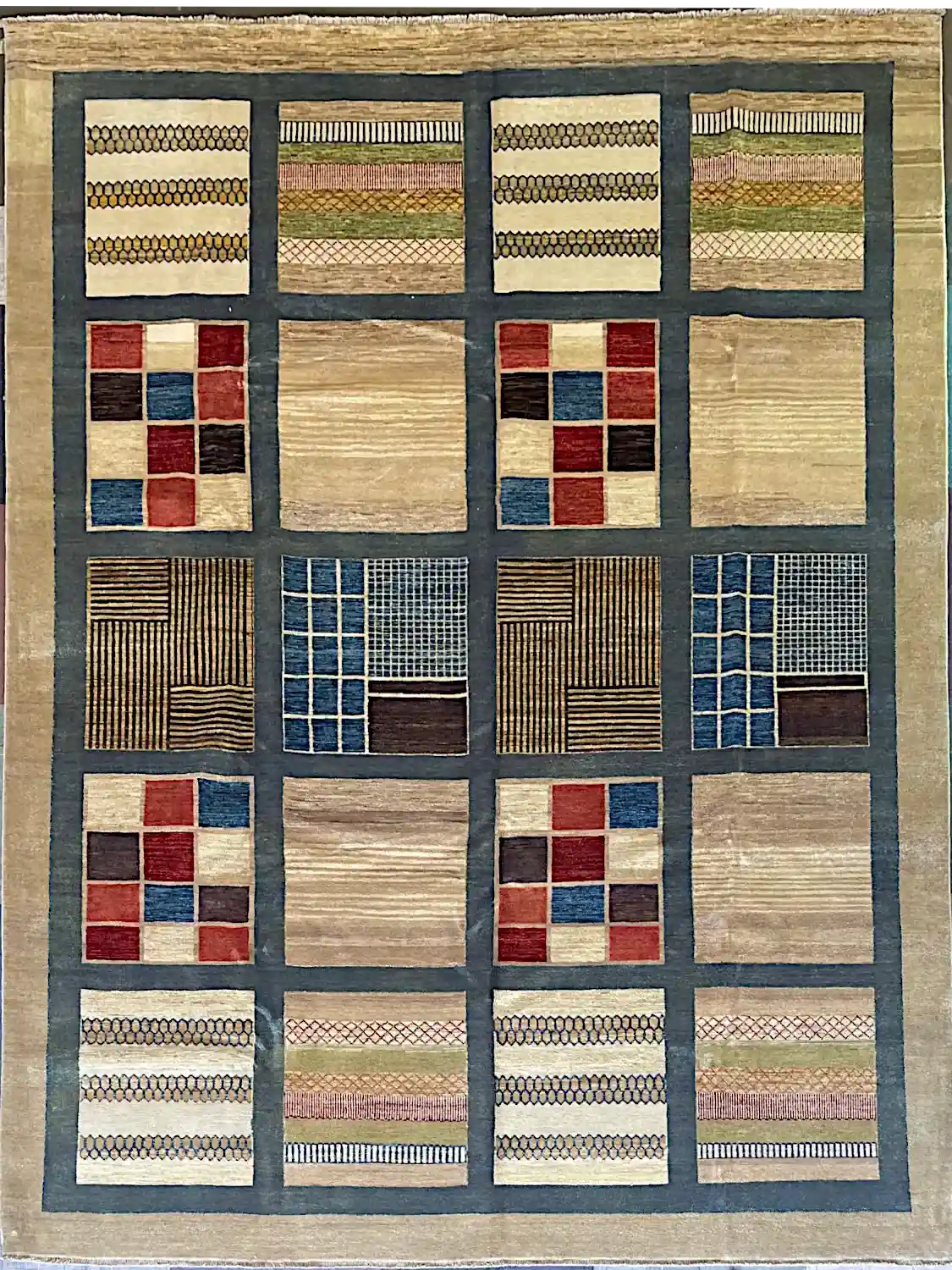 modern-geometric-patchwork-wool-area-rug-9x12.webp | McFarlands Carpet and Rug Service Modern hand-knotted wool area rug 9.1' x 12.4' featuring an illustrative twenty-square patchwork grid framed in slate blue.