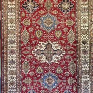 Traditional red Kazak hand-knotted wool area rug 9.10' x 15.2' featuring a central ivory cross medallion layout and a wide cream border frame.