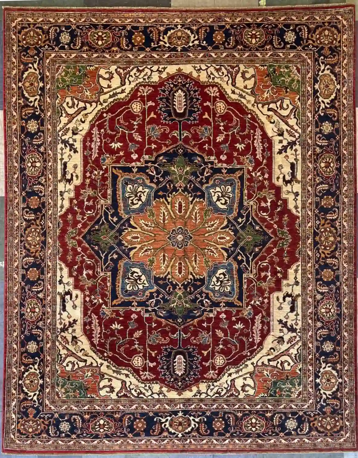hand-knotted-chobi-wool-area-rug-8-2-x-10-4-red-navy-medallion-sku-112525-8.webp | McFarlands Carpet and Rug Service Red Hand-Knotted Chobi Wool Area Rug 8.2' x 10.4' with a navy starburst central medallion and a dark navy border.