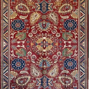 Symmetrical red hand-knotted Chobi wool area rug 8.2' x 10.1' featuring navy rosettes and a geometric zig-zag border.