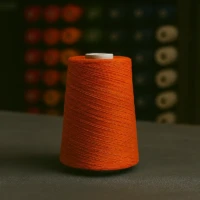 Orange rug serging yarn spool